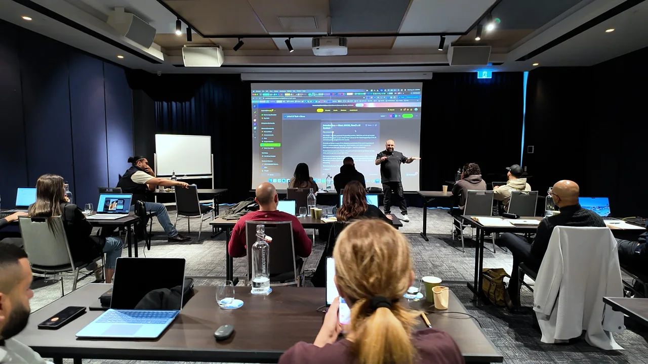A LaunchHub presenter leading a workshop with participants working at laptops
